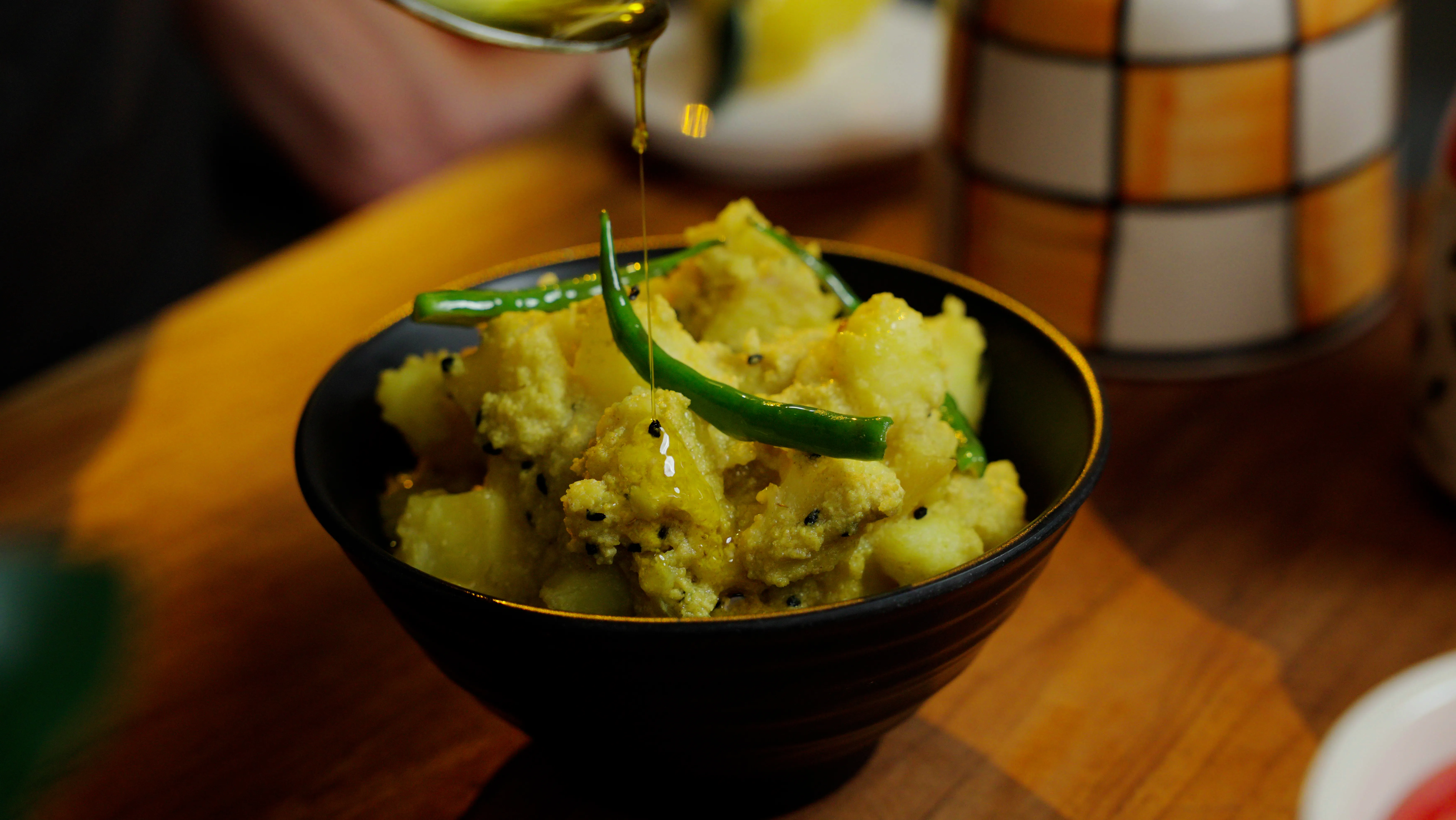 Bengali aloo posto made with potatoes in a creamy poppy seed sauce.