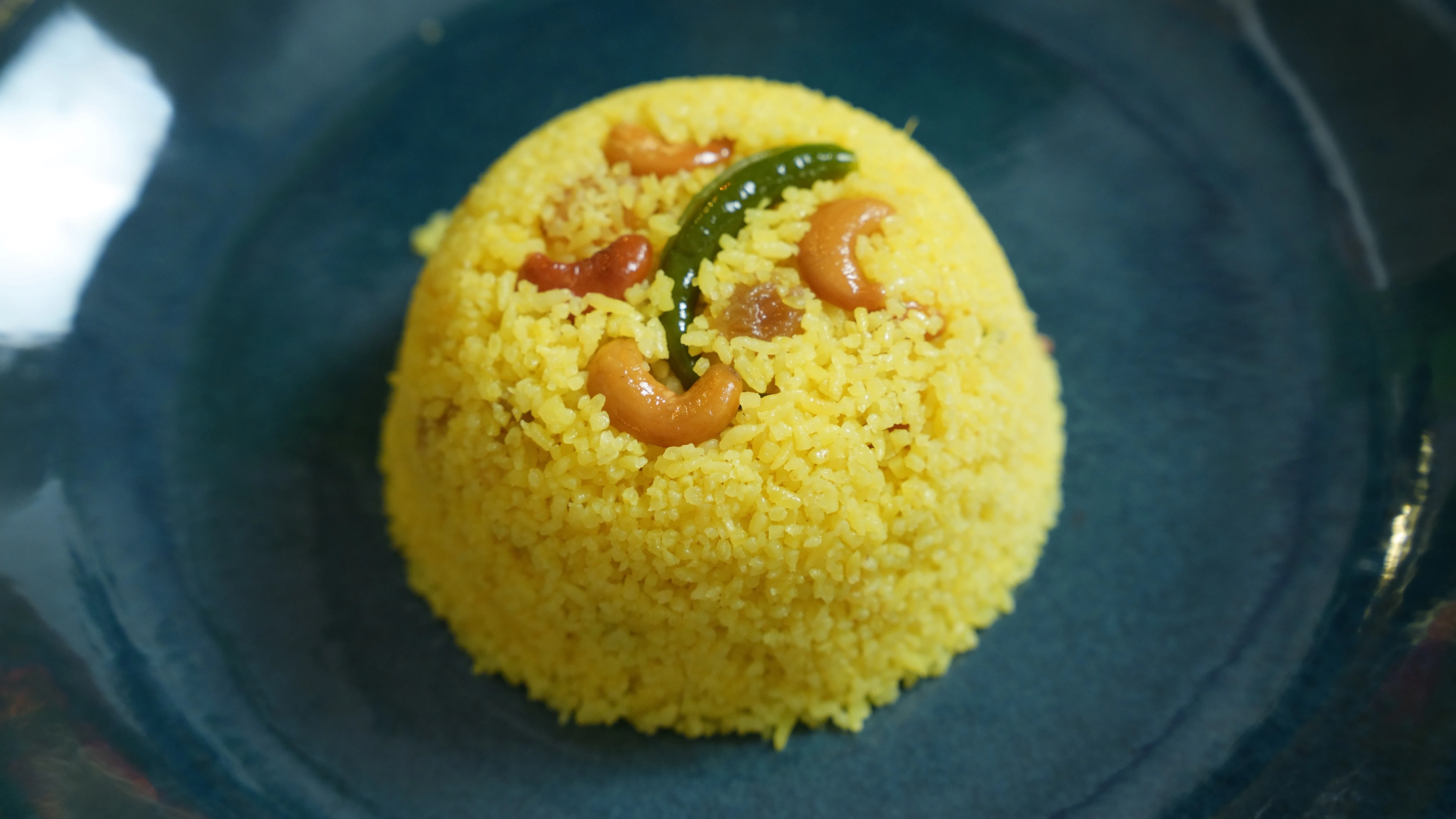 Bengali Basanti Pulao with golden Gobindobhog rice, cashews and raisins.