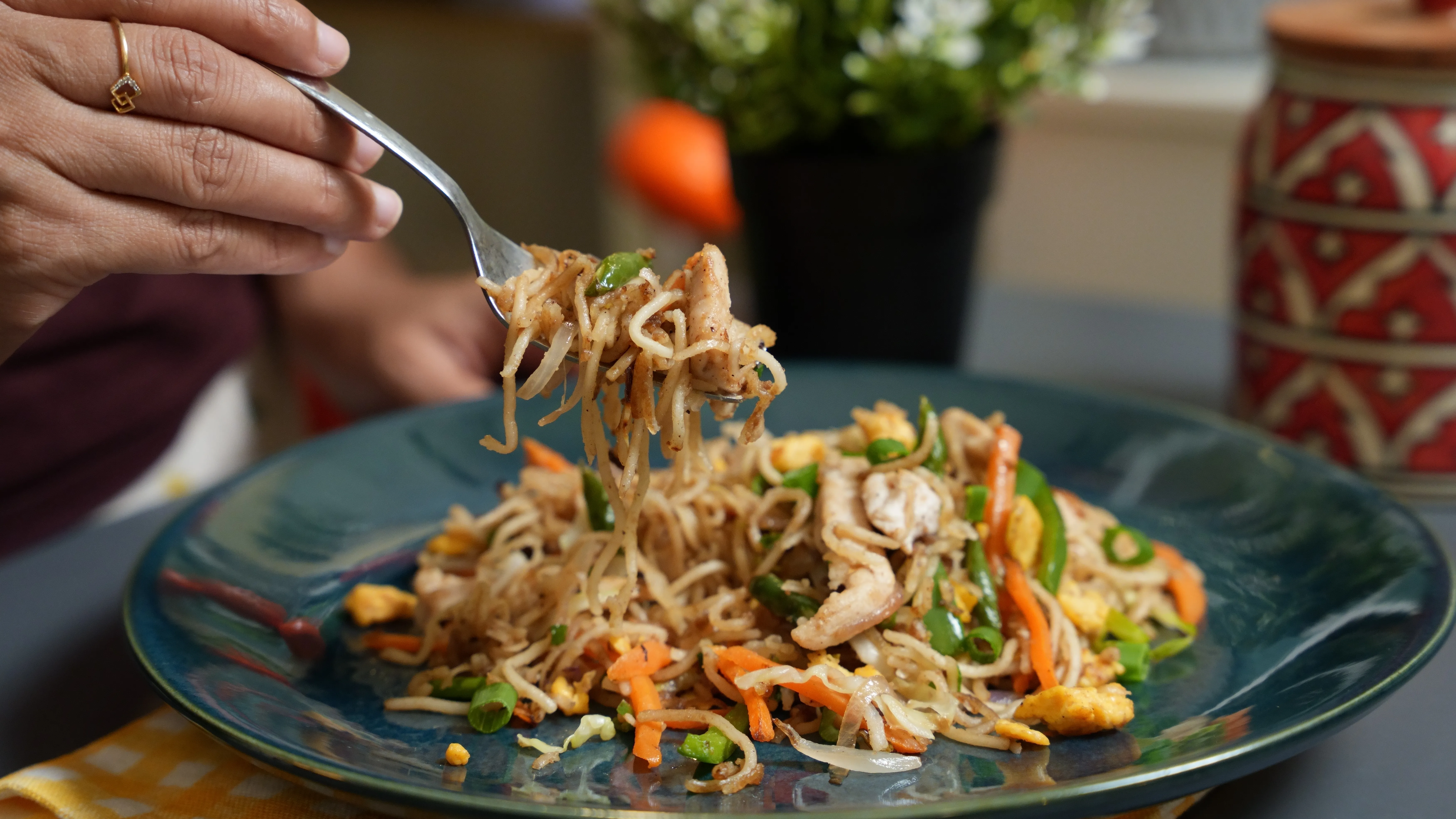 Kolkata street-style chicken chowmein with noodles, chicken, egg, cabbage, carrot, capsicum and spring onion.