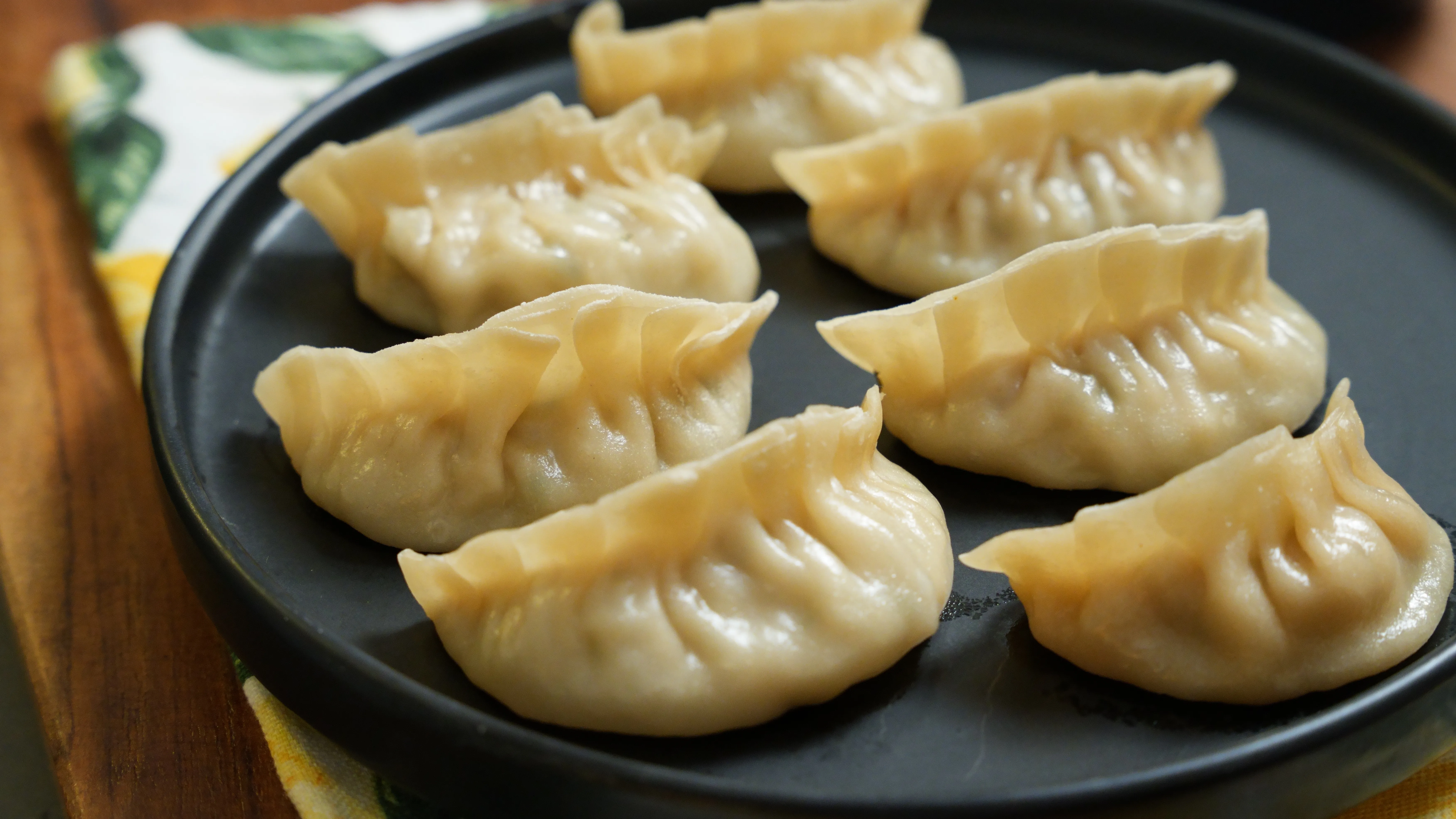 Freshly steamed Chicken Momo with thin handmade wrappers and juicy chicken filling.