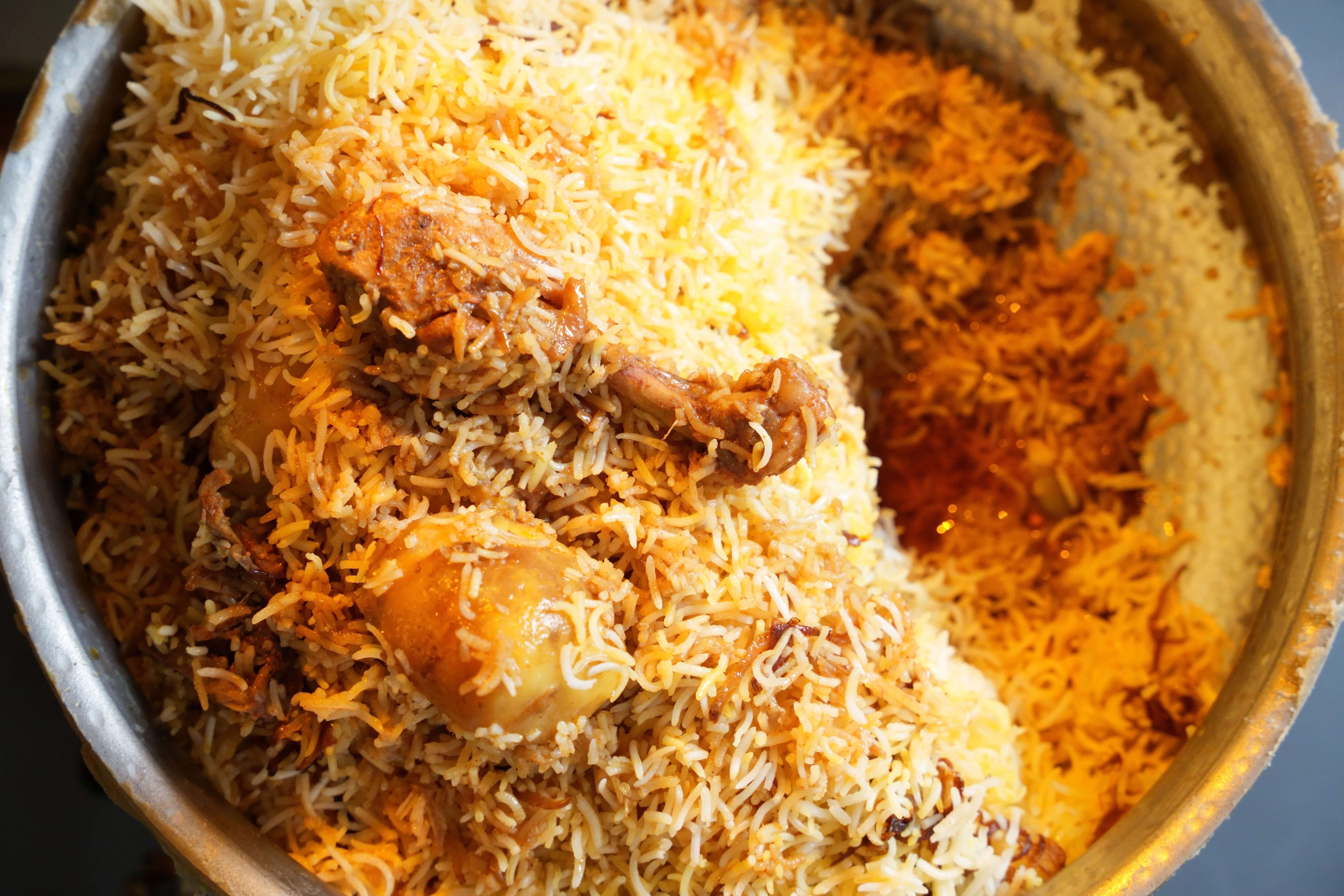 Kolkata chicken biryani layered with fragrant basmati rice, chicken and potatoes.