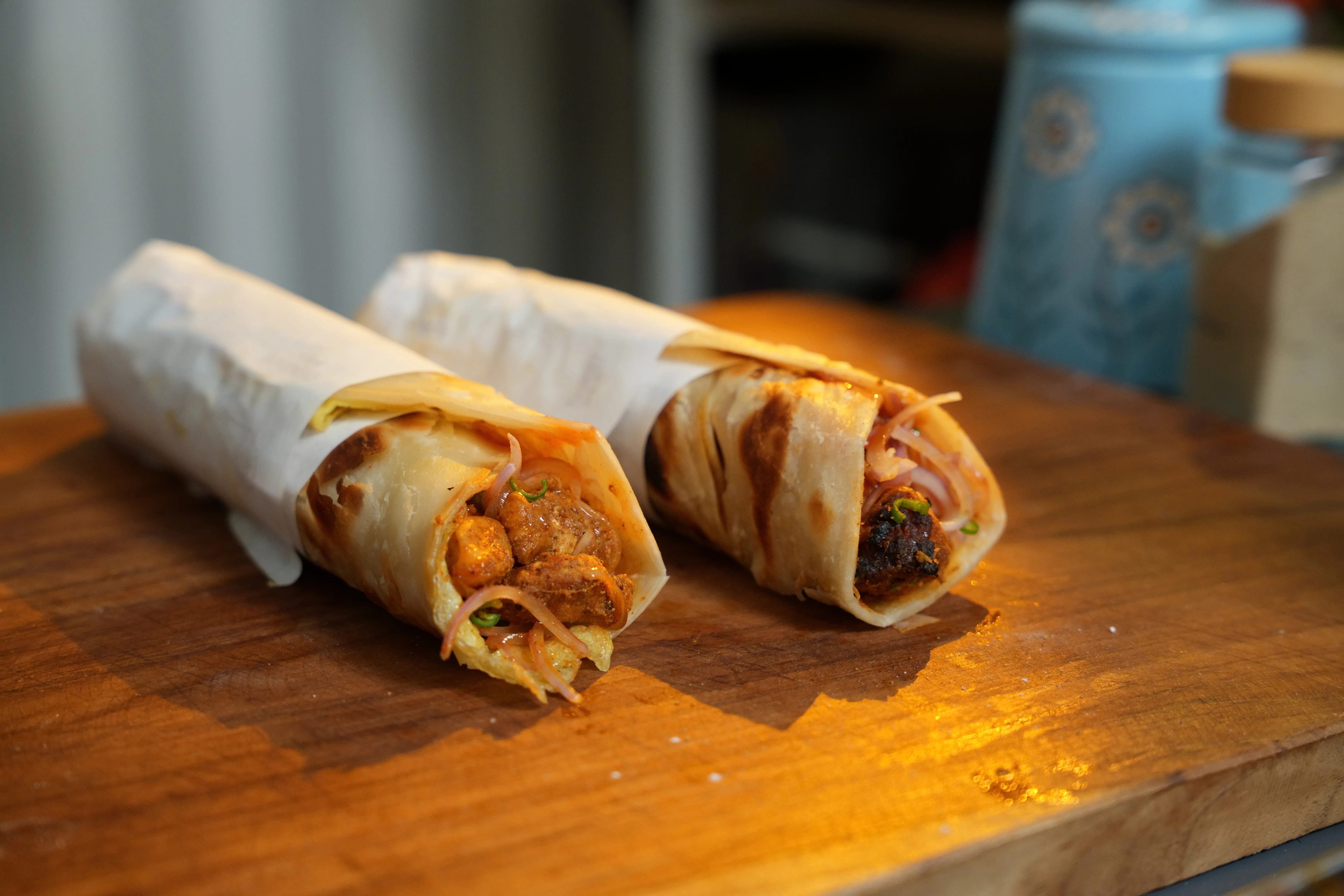 Kolkata chicken roll with flaky laccha paratha and chicken filling.