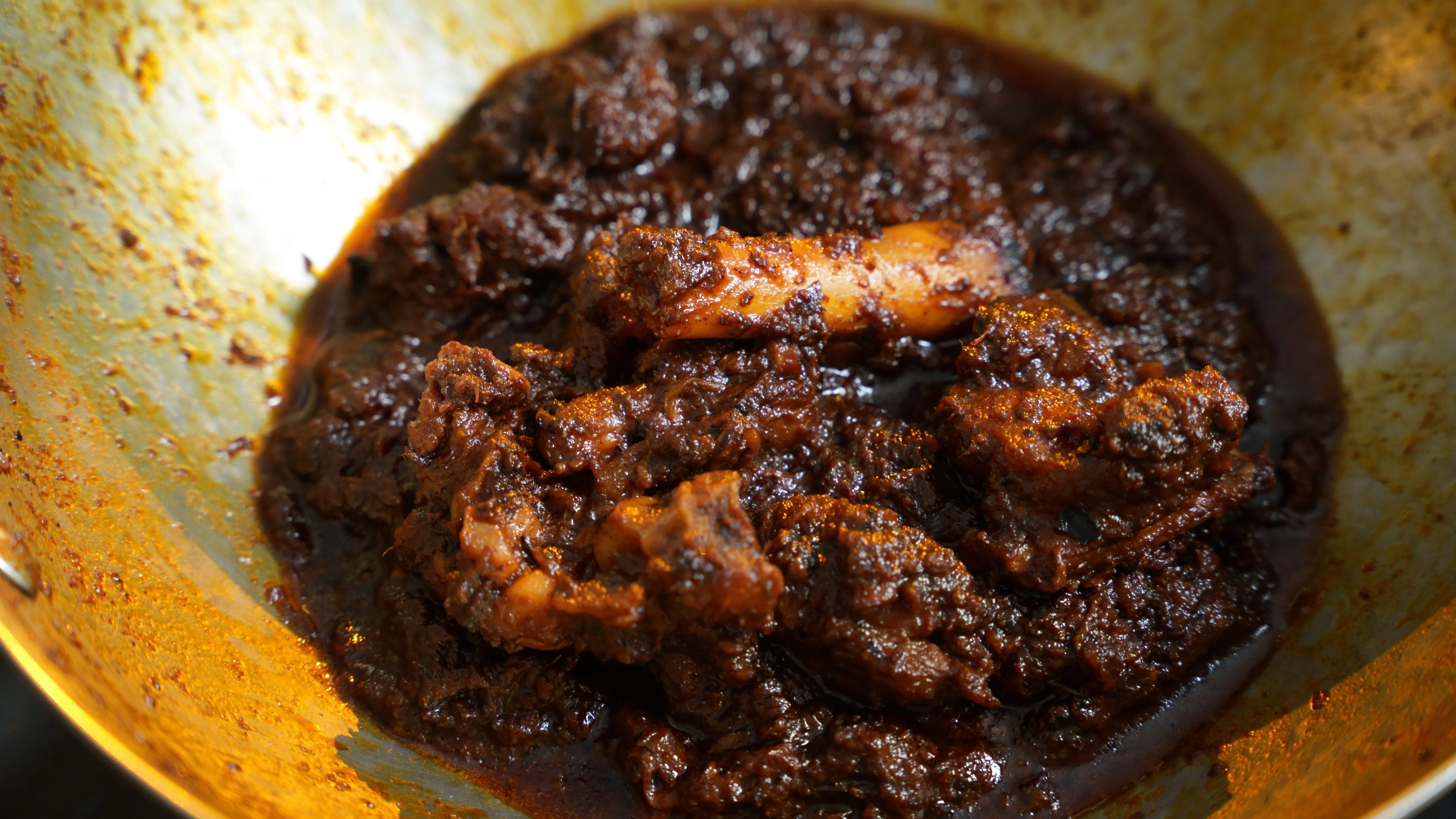 Traditional Bengali Mutton Kosha served in a bowl with thick glossy gravy and tender slow-cooked mutton.